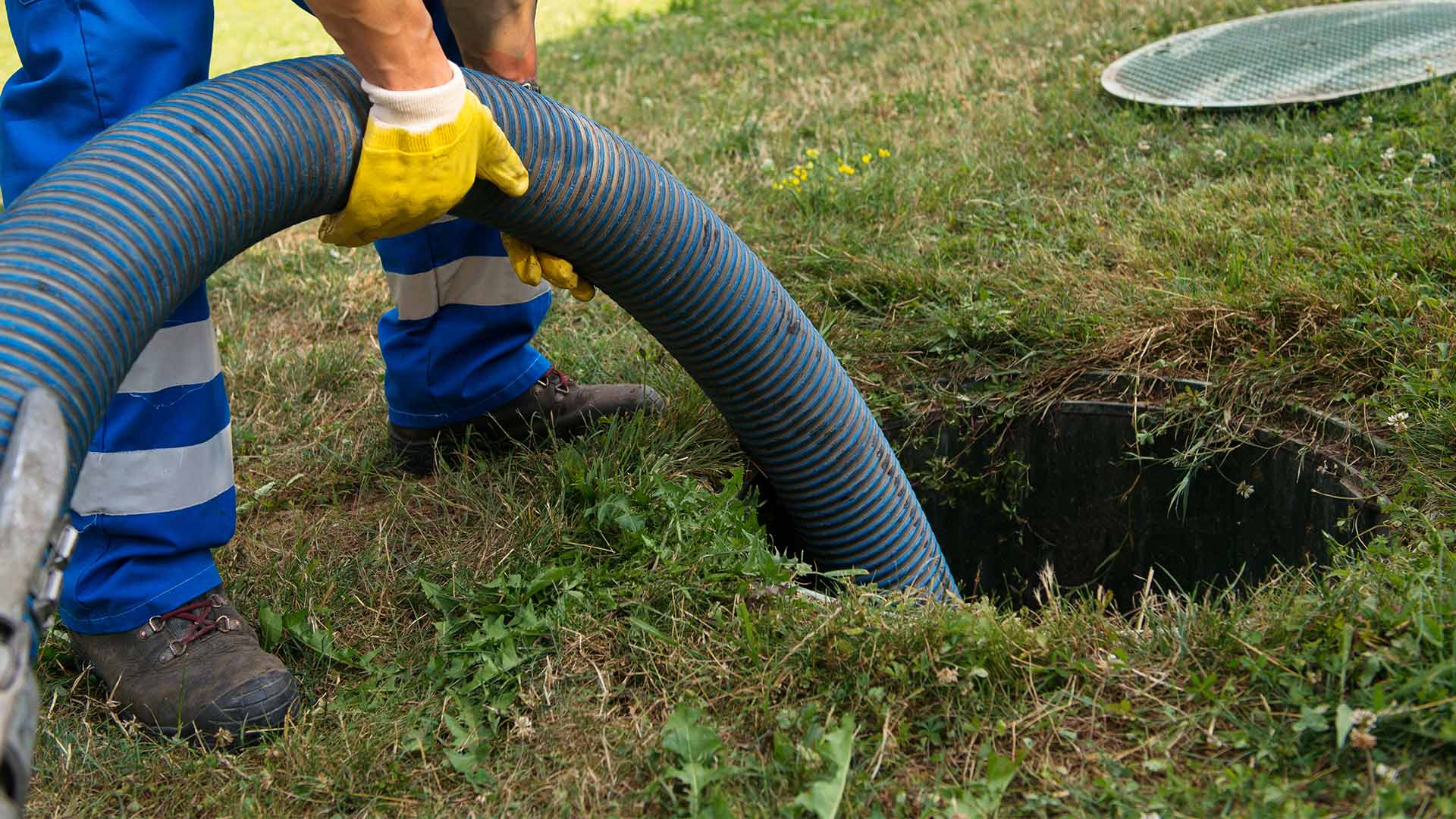 contractor close up cleaning sewer line at residential property exteriors glenmora la