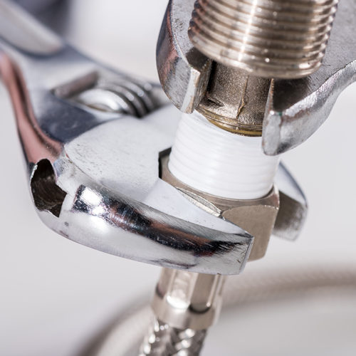 plumbing tool close up screwing kitchen pipe glenmora la